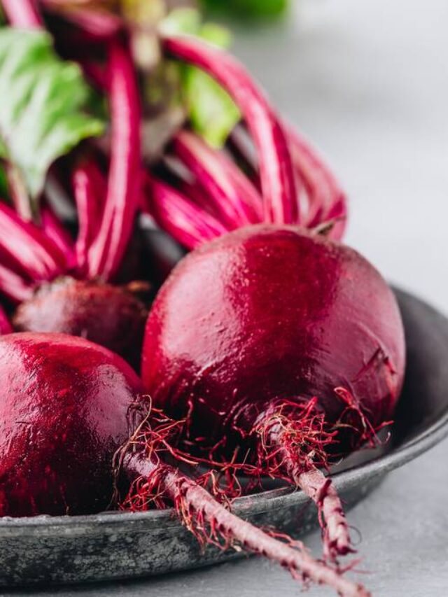 Bunch of fresh raw organic beets with leaves